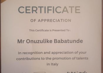 Mr Onuzulike Babatunde receives an award of appreciation towards his contributions to the talents in Italy