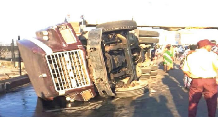 Driver Escapes Death as Truck Overturns in Lagos