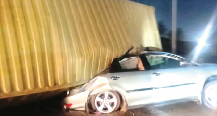 Lagos Couple Escapes Death as Container Falls on Vehicle