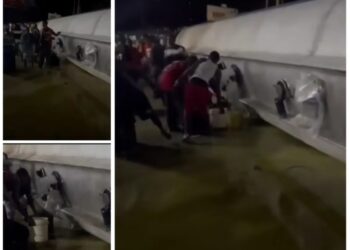 Fuel Tanker Falls in Port Harcourt, Residents Scoop Spilled Petrol Despite Explosion Risk