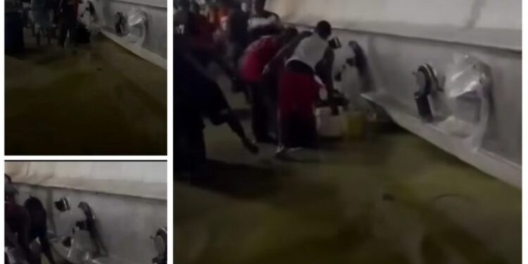 Fuel Tanker Falls in Port Harcourt, Residents Scoop Spilled Petrol Despite Explosion Risk