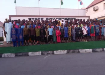 Governor Umar Bago receives the 100 rescued schoolchildren