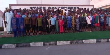 Governor Umar Bago receives the 100 rescued schoolchildren