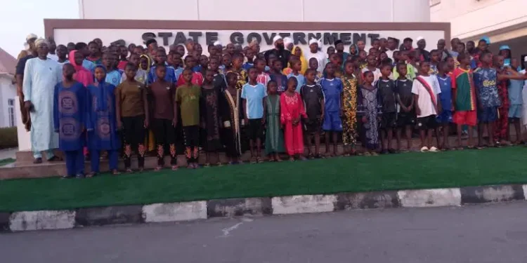 Governor Umar Bago receives the 100 rescued schoolchildren