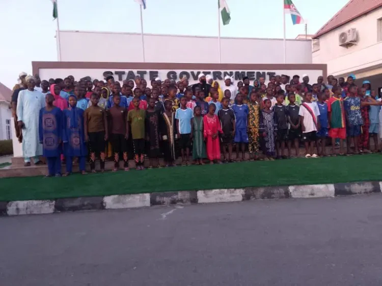 Governor Umar Bago receives the 100 rescued schoolchildren